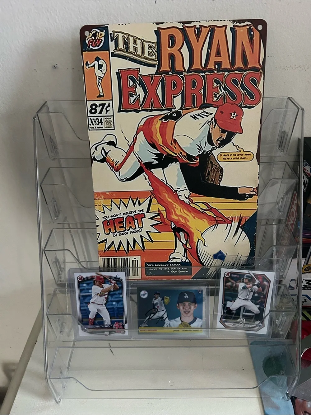 Tin sign with 3 rookies.